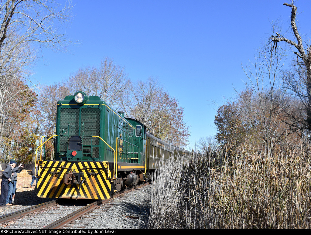 SMS Lines Baldwin S-12 304 on the south end of the passenger as it is stopped just before the Mannington Mills Rd Grade Crossing